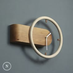 a clock made out of wood on the wall