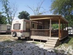 an rv is parked in front of a house