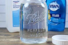 a glass jar with the words perfect mason written on it next to some other bottles