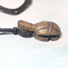 Peru Hand-Carved Natural Wooden Turtle Tortoise Pendant Necklace A Steadfast Turtle Is Hand-Carved From Natural Guacayan Wood, Centering Simple Black Cord That With No Closure. Cord Measures 12" Long #Turtle #Tortoise #Wood #Handcarved #Animals #Handmade Location Wood Or Naturefloweranimals Wood Necklace Pendant, Wooden Turtle, Dove Necklace, Chunky Bead Necklaces, Animal Necklace, Halloween Necklace, Tooth Necklace, Tigers Eye Necklace, Long Pearl Necklaces