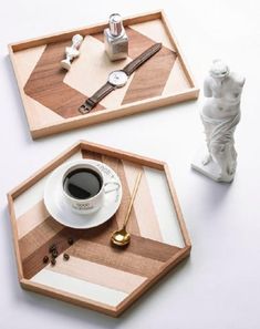 two wooden trays with coffee cups on them