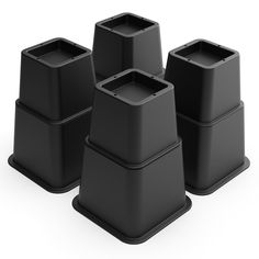 four black plastic containers sitting on top of each other