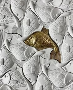 gold fish on white paper with black background