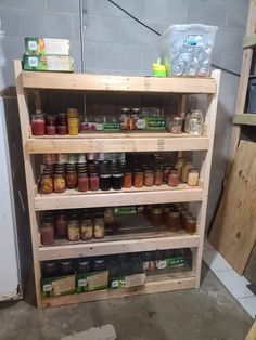 the shelves are filled with jars and spices