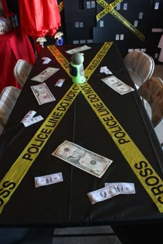 the table is decorated with police tape and money