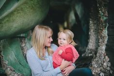 a woman holding a small child in her arms