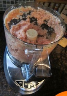 a blender filled with food on top of a counter