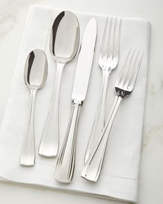 the silverware is laid out on the napkin