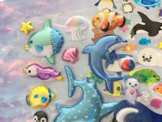 an assortment of sea life stickers on a plastic sheet