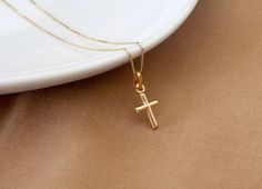 Solid Gold Cross Necklaces Made in Italy Guaranteed SOLID 10K GOLD, Stamped 10K Dainty 10K SOLID Gold Box Chain: 0.5 mm Small Cross size (not including bail): 15 mm X 13 mm x 2 mm Real Solid Gold Box Chain is secured with a Solid Gold spring clasp. Invest in SOLID GOLD: It's what's on the inside that counts. Unlike gold plated, filled or vermeil- SOLID GOLD is built to last, and won't rub off or change color over time. Perfect for those with sensitive skin as NO allergy metals are used! Tiny Cross Necklace, Letter Charm Necklace, Real Gold Chains, Custom Initial Necklace, Sterling Silver Anklet, Gold Rope Chains, Gold Cross Necklace, Gold Box, Silver Anklets