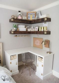 a corner desk with some shelves above it