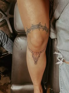 a person with a tattoo on their leg