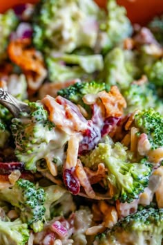 broccoli salad in a bowl with a fork