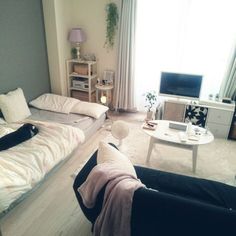 a living room filled with furniture and a flat screen tv