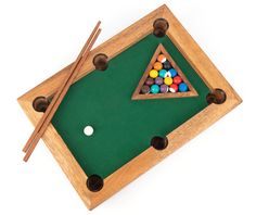 a pool table with cues and balls on it