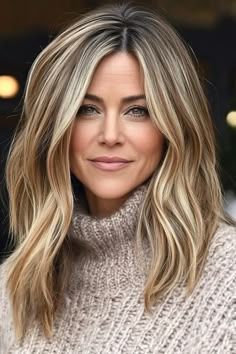 20 Jennifer Aniston Hairstyles for You to Try Out Long Brown Hair Blonde Highlights, Layered Haircuts For Medium Long Hair, Hairstyles Parted In The Middle, 2024 Trending Hairstyles, Long Blonde Highlighted Hair, Long Bangs Side Part, Mid Length Hairstyle Women, Middle Part Highlights, Hairstyles Jennifer Aniston