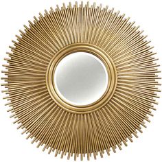 a gold sunburst mirror on a white background