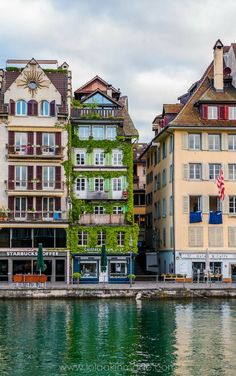 some buildings that are next to the water