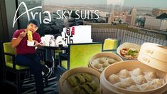 a man sitting at a table with some food in bowls on top of it and the words aria sky suites above him