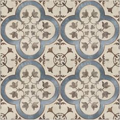 an old tile floor with blue and white designs