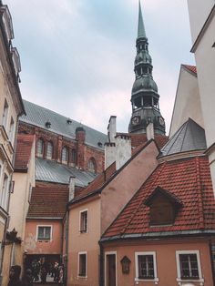 an old building with a steeple in the background