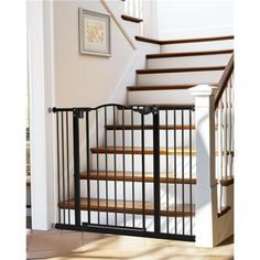 a stair gate is open on the stairs