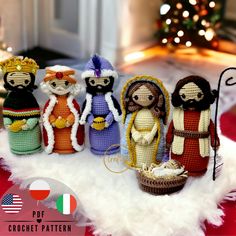 crocheted nativity figurines displayed in front of a christmas tree