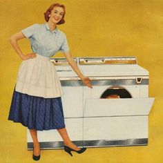 a woman standing in front of an oven