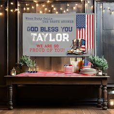 a table with a sign that says, god bless you taylor we are 90 proud of you