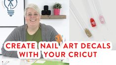 a woman sitting at a table with some crafting supplies on the wall behind her