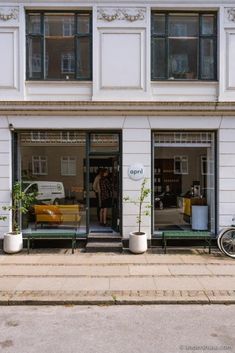 a bike parked in front of a white building