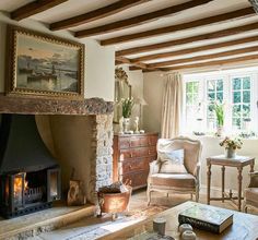 a living room filled with furniture and a fire place