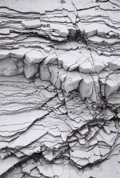 black and white photograph of cracks in the rocks