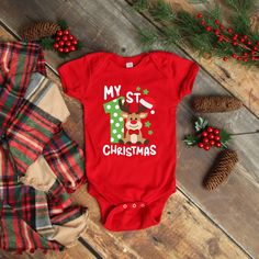 Everyone loves babies 1st Christmas; this onesie® is so cute and will be the talk of any holiday event on your baby boy or baby girl. Onesie® comes in four colors Black, Gray, Red & White and sizes of your choice. We use high quality, soft flex vinyl which not only creates a sharp, vivid graphic but will never look "faded" or “washed out” like some inks commonly do. Processing time is 2-4 days, delivery will depend on your choice at checkout First Class Mail 5-7 days, Priority Mail 2-4 days & Pr My 1st Christmas, Black Onesie, Christmas Bodysuit, Newborn Christmas, Santa's Little Helper, Christmas White, Girl Onesies, Unisex Baby Clothes, Santa Baby