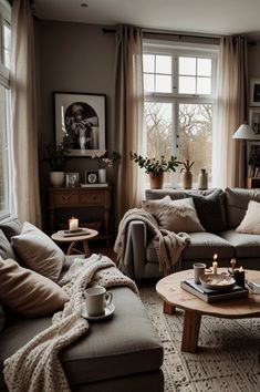 a living room filled with furniture and candles