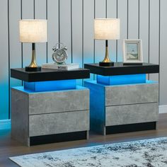 two nightstands with blue lights on each side