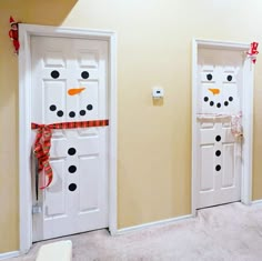 two white doors decorated with snowmen and bows