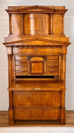 an old fashioned wooden desk with drawers