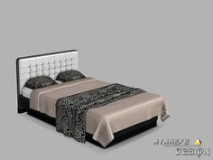 the bed is made up with black and white sheets, pillows, and headboard