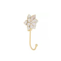 a gold and white flower shaped umbrella hook