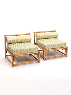 two bamboo lounge chairs with matching cushions on each side, one in the shape of a reclining couch