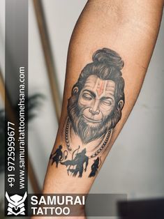 a man with a lion tattoo on his arm and the words samurai tattoo written below it