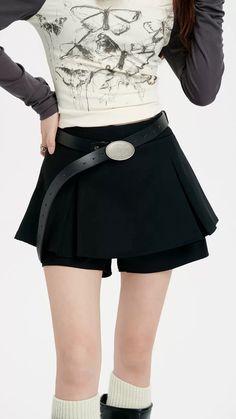 Revamp your wardrobe with the timeless chic of our Pleated Mini Skirt featuring an eye-catching oversized belt detail. This mini skirt channels a blend of sophistication and playful charm with its high-waisted A-line silhouette and crisp pleating. Crafted from a mix of polyester and viscose fibers, it provides both comfort and a flattering drape. The solid color and retro vibe make it a versatile piece for a multitude of settings, from casual outings to more formal affairs. Style this skirt with Chic Mini Length Bottoms With Belt Loops, Chic Mini Bottoms With Belt Loops, Relaxed Fit Skirt With Belt Detail For Spring, Relaxed Skirt With Belt Detail For Spring, Elegant Relaxed Skirt With Belt, Spring Skirt With Belt Loops For Night Out, Elegant Skirt With Belt, Elegant Pleated Skirt With Belt, Spring Night Out Skirt With Belt Loops