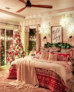 a bedroom decorated for christmas with lights on the ceiling and a tree in the corner