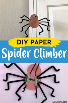 the paper spider is hanging from a string