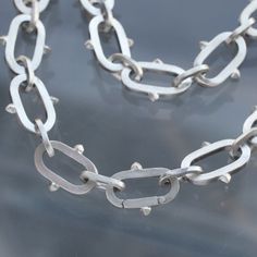 Punk valor lives on in this sculpted studded chain with a smooth hidden clasp. Available in solid sterling silver as a 16", 18", 20" or 24" necklace (or wear it as a belt chain, OG punk style). Handmade by Morgaine Faye in her Portland Studio. Handmade Silver Chain, Belt Chain, Handmade Chain, Stacking Bands, Silver Chains, Funky Jewelry, Punk Style, Jewelry Inspo, Crafty Stuff