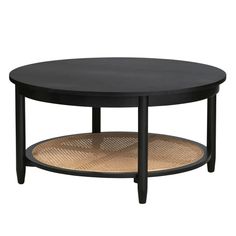 a black coffee table with two wicker baskets on the bottom and an oval wooden top