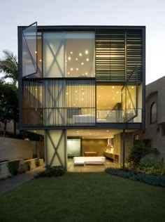 an apartment building with glass balconies on the second floor