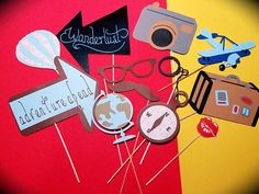 a bunch of items that are on top of a red and yellow background with the words wanderlust