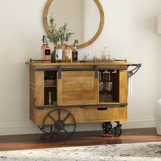 an old fashioned bar cart with bottles and glasses on it